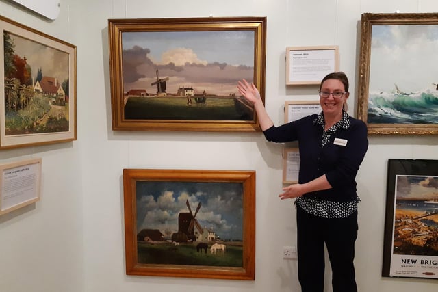 Claire Lucas, museum manager, with the two paintings of Sea Mill in Rustington, a generation apart