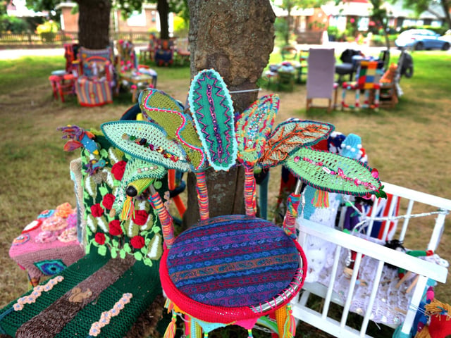 East Preston Yarnbombers have created an enchanting picnic area with chairs that are beautifully-decorated knitted masterpieces