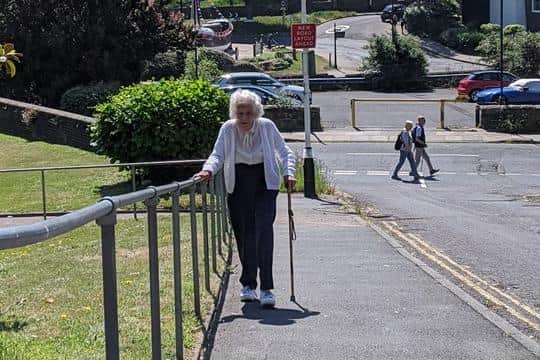 Joan walking outside her care home. Picture: Contributed