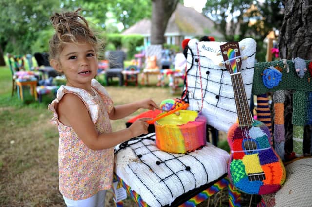 East Preston Yarnbombers have created an enchanting picnic area with chairs that are beautifully-decorated knitted masterpieces