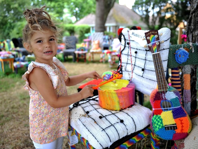East Preston Yarnbombers have created an enchanting picnic area with chairs that are beautifully-decorated knitted masterpieces