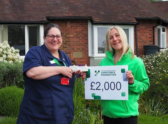 Nurse Louise McIntyre and St Peter and St James' relationship fundraiser Victoria Webber celebrate the £2,000 donation for new equipment.