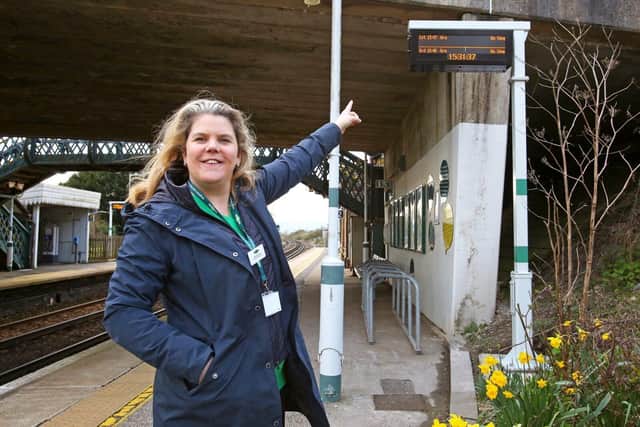 Show time: Southern Station Manager Charlotte Raeburn with one of Glynde's new information screens.