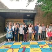Labour councillors with a giant cost of living themed game of snakes and ladders