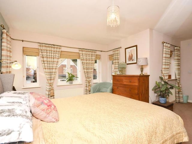We've moved upstairs now, and this is bedroom number one. As with all the rooms in the house, it is immaculately presented, with the window facing the front of the property. It boasts its own en suite too.