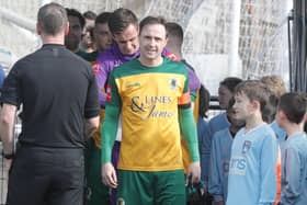 Gary Charman prepares to lead Horsham out in the final game of his career in March. Picture by John Lines