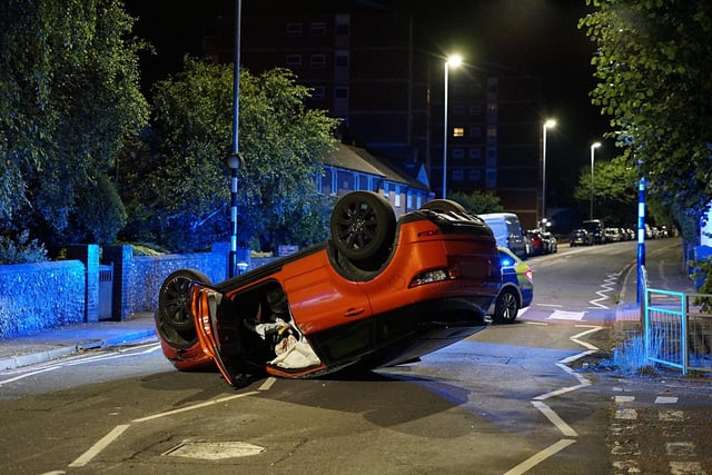 A Range Rover was overturned last night at 11.30pm following a collision with a collision with a parked vehicle on Upperton Road in Eastbourne. Picture: Dan Jessup