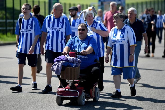 Brighton and Hove Albion fans arrive at the stadium prior to the Premier League match between Brighton & Hove Albion and Fulham FC at American Express Community Stadium on September 1, 2018.