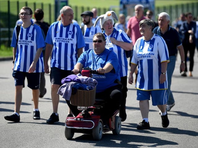 Brighton and Hove Albion fans arrive at the stadium prior to the Premier League match between Brighton & Hove Albion and Fulham FC at American Express Community Stadium on September 1, 2018.