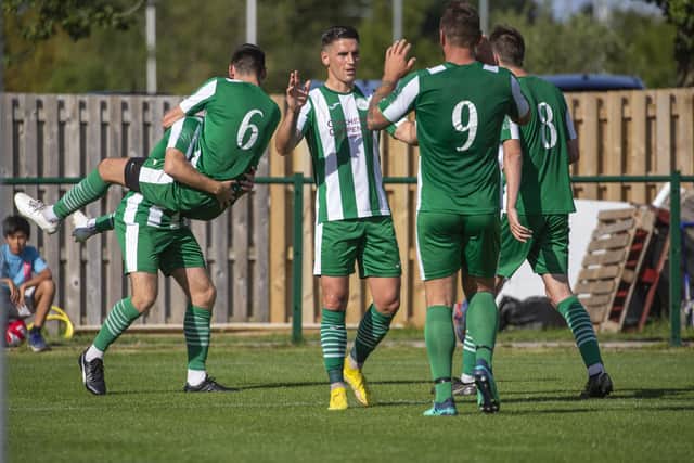 Chichester City celebrate one of their three goals at Broadbridge Heath | Picture: Neil Holmes