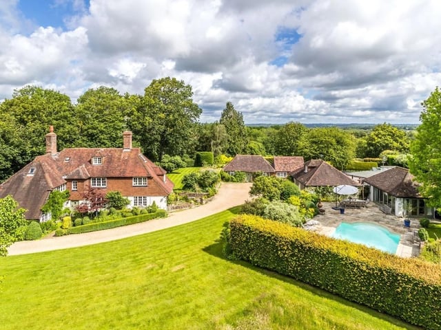 The secluded property has a paddock, formal gardens, mature trees and a large lawned area