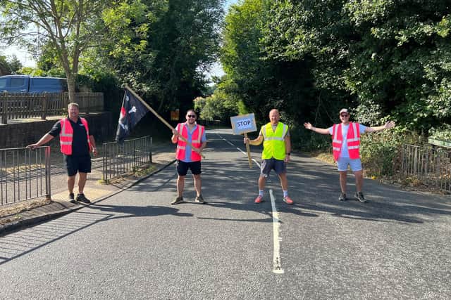 Matt Lake (in the yellow hi-vis jacket) with his friends at the Turners Hill cross roads