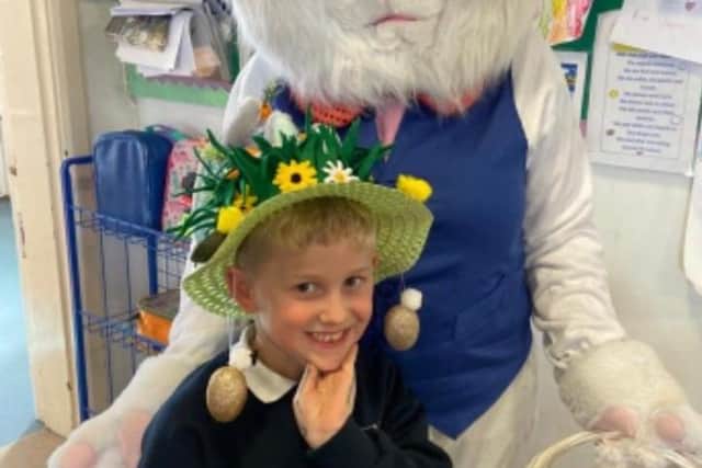 One of the Easter bonnet winners with the Easter Bunny