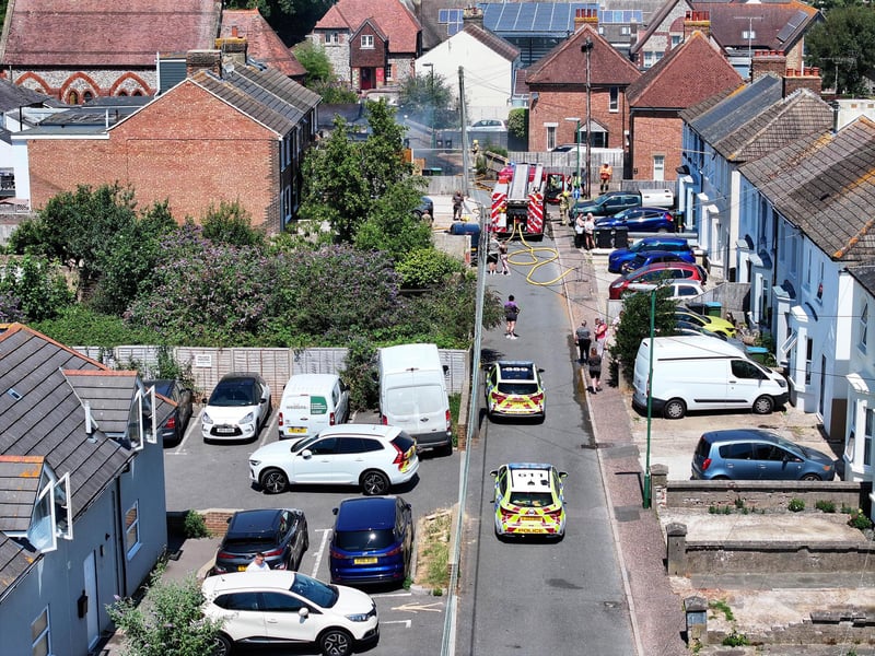 Firefighters tackle a blaze that destroyed two sheds, on Beaconsfield Road