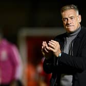 Scott Lindsey, Head Coach of Crawley Town, applauds the fans after his side beat MK Dons 2-1. (Photo by Mike Hewitt/Getty Images)