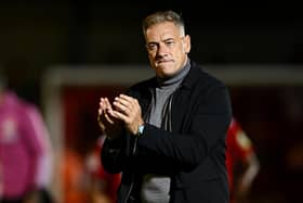 Scott Lindsey, Head Coach of Crawley Town, applauds the fans after his side beat MK Dons 2-1. (Photo by Mike Hewitt/Getty Images)