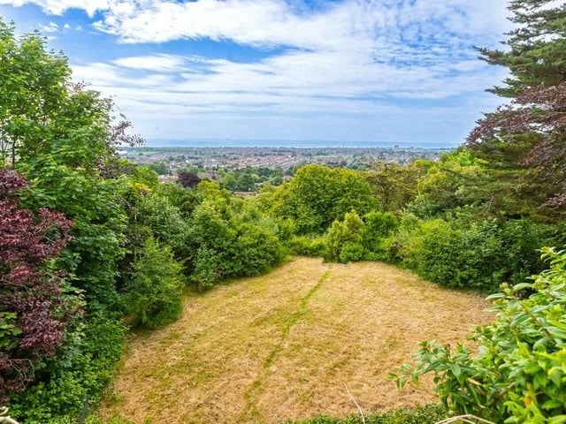 This substantial detached family house sits on the highest point in North Lancing, with grounds totalling 0.5 acres of land. Offers in the region of £1million are invited for this four-bedroom property at the foot of the South Downs National Park, with magnificent panoramic coastal views.