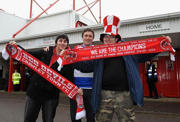 Crawley Town fans pose outside the ground prior to the FA Cup third round match against Reading on January 5, 2013.