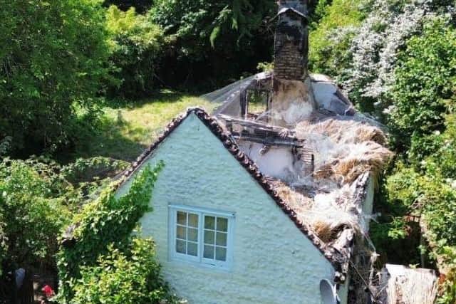 Thatch Cottage was severely damaged by fire on February 1, 2023, and remains in a state of ruin. Picture: Manorwood / planning documents