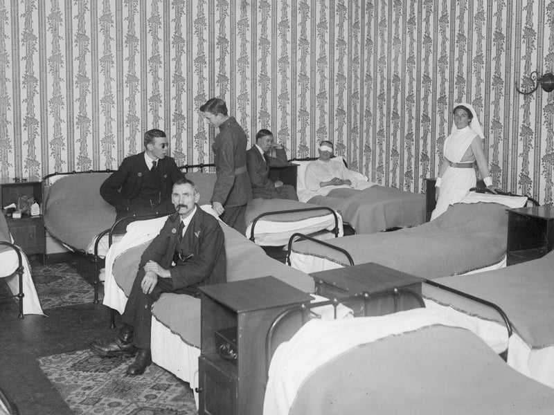 A group of blind soldiers in a bedroom at West House in Brighton in August 1917.