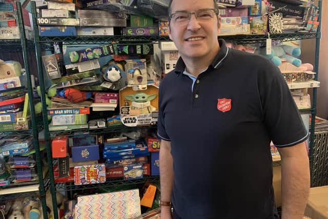 Major Iain Stewart begins to sort gifts for children and families this Christmas
