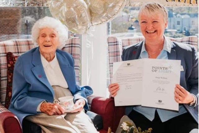 Joan with her friend Pauline Glenet and the Points of Light Award certificate