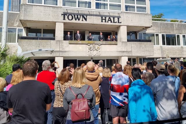 Crowds watch on as Crawley Mayor Jilly Hart reads the Proclamation of Accession