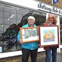 Anthony Hole and Sons began trading in 1897, and past and present owners Peter Jeffery (right) and Julie Richards (left) were at the shop for the presentation of artwork depicting the business over the years, by artist Lyndsey Smith (centre)