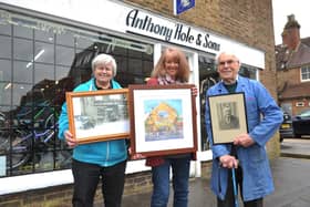 Anthony Hole and Sons began trading in 1897, and past and present owners Peter Jeffery (right) and Julie Richards (left) were at the shop for the presentation of artwork depicting the business over the years, by artist Lyndsey Smith (centre)