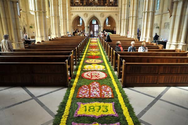 Arundel Cathedral is celebrating the feast of Corpus Christi with the magnificent festival of flowers which started 150 years ago, featuring a world famous Carpet of Flowers in the central aisle of the Cathedral. Pic S Robards SR2306071