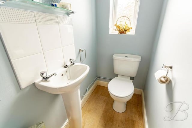A downstairs toilet is always handy. This is the one at Spindle Court, with a pedestal sink, low-flush WC and opaque window facing the back of the property.