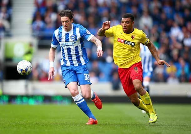 BRIGHTON, ENGLAND - APRIL 25:  Greg Halford of Brighton and Troy Deeney of Watford tackle for the ball during the Sky Bet Championship match between Brighton & Hove Albion and Watford at Amex Stadium on April 25, 2015 in Brighton, England.  (Photo by Jordan Mansfield/Getty Images)