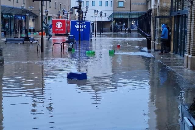 Both sides of Priory Meadow Shopping Centre are underwater. Photo: East Sussex Fire and Rescue Service
