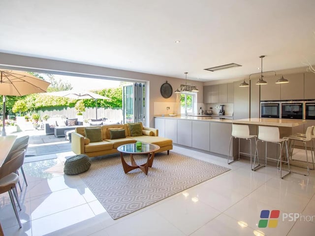 The kitchen/dining/family room is the heart of the home, offering an open plan area with bi-fold doors opening to the garden