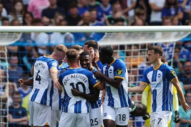 Brighton's Ecuadorian midfielder Moises Caicedo (C) celebrates with his teammates after scoring against Premier League rivals Leicester City