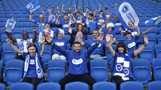 BHAFC and Albion in the Community staff in blue and white in the stands of the Amex stadium