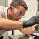 Planet Ocean representative preparing a seawater sample for analysis. Photo: Worthing Borough Council