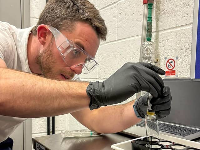 Planet Ocean representative preparing a seawater sample for analysis. Photo: Worthing Borough Council