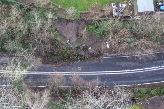 The landslide - seen from the air - which has closed the A29 at Pulborough and has led to a drop-off in trade for local businesses. Photo: Eddie Mitchell