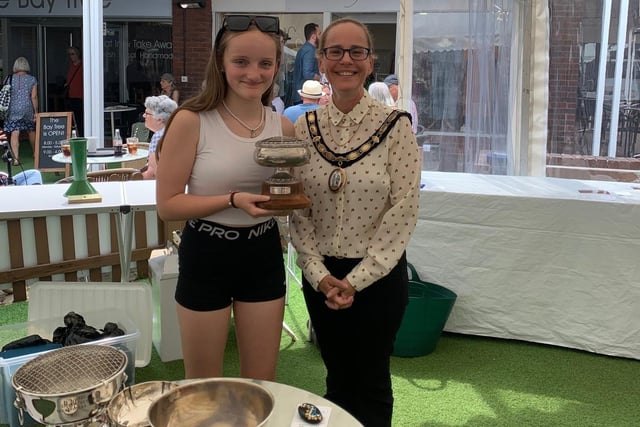 Town mayor Stephanie Inglesfield presents Zoe Burchill with the Best Junior Award for her Painted Pebble
