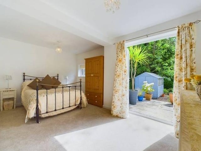 The ground-floor bedroom has an en-suite shower room