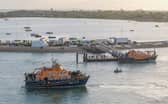 Around 140 migrants arrive in Portsmouth, Hampshire after being transferred from a single dingy south of the Isle of Wight in the English Channel by two RNLI lifeboats, a mammoth operation is talking place on Sunday evening to process the illegal migrants, with dozens of government workers from Police, Border Force, Ambulance and Fire crews, along with a number of transport busses.  Dated 06/09/26.