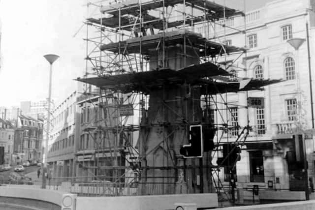 Scaffolding surrounding the Memorial clock tower which was controversially demolished following a fire.