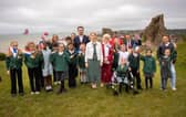Helena Dollimore MP (centre) with school children