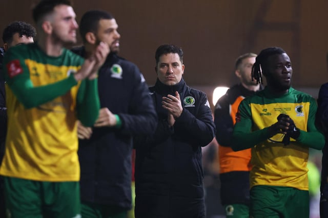 Dominic Di Paola, Manager of Horsham, acknowledges the fans following the Emirates FA Cup First Round Replay match between Horsham and Barnsley at The Camping World Community Stadium.