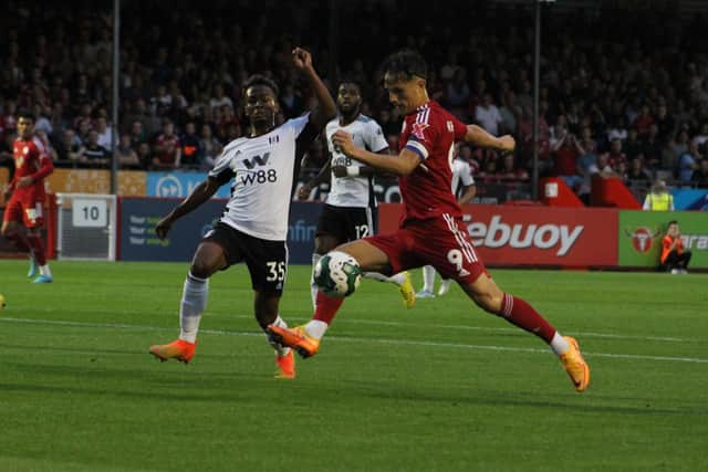 Tom Nichols scores the first goal against Fulham