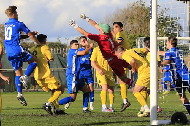 Copthorne's Keeper Will Murphy punches clear from a Selsey corner | Picture: Chris Hatton