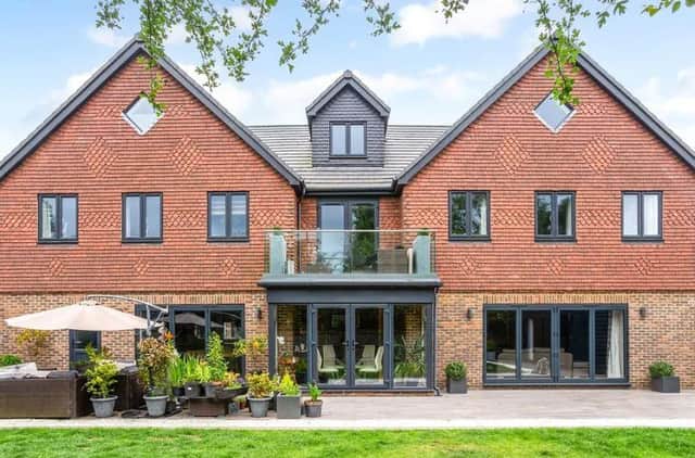 This five-bedroom modern family house is situated in Kerves Lane, Horsham, and is on the market with a guide price off £1,750,000