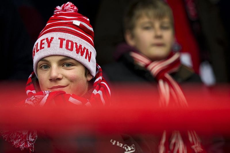 A young Crawley Town supporter looks on ahead of the English FA Cup third round football match between Crawley Town and Reading at Broadfield Stadium on January 5, 2013.