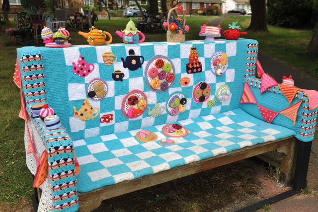 East Preston Yarnbombers have created an enchanting picnic area with chairs that are beautifully-decorated knitted masterpieces